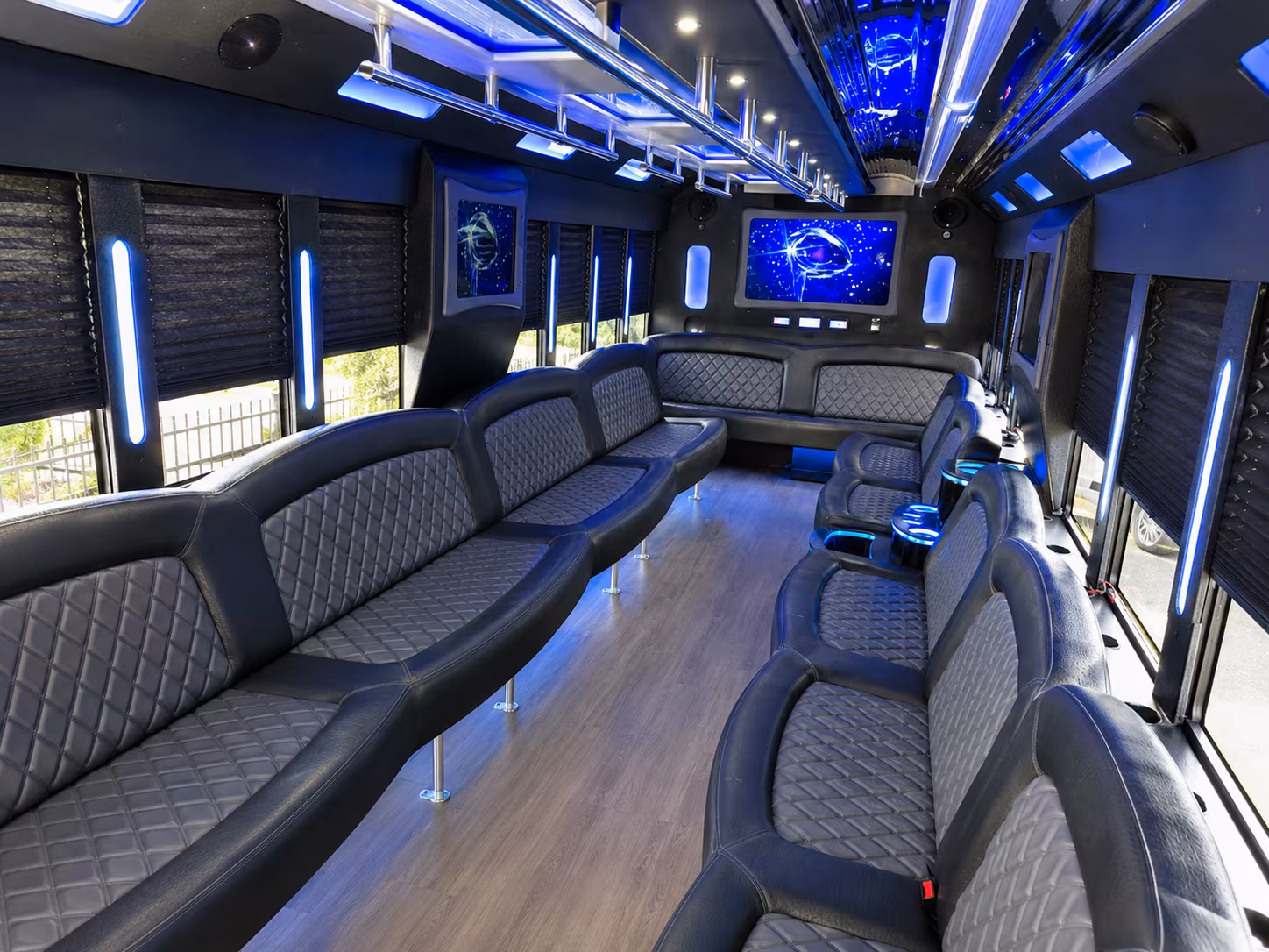 Wedding guests seated inside a party bus serving Lansing
